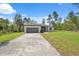 Beautiful single-story home featuring a two-car garage and a long driveway with landscaped front yard at 3072 Sw 168Th Loop, Ocala, FL 34473
