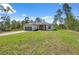 Charming single-story home with well-maintained lawn and a paved driveway leading to an attached garage at 3072 Sw 168Th Loop, Ocala, FL 34473