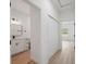 Hallway leading to the bathroom and bedroom with natural light coming from the window at 3072 Sw 168Th Loop, Ocala, FL 34473