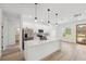 Modern kitchen featuring white cabinets, a central island, and stainless steel appliances at 3072 Sw 168Th Loop, Ocala, FL 34473