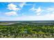 Stunning aerial view showcasing the expansive community surrounded by verdant landscapes and multiple serene lakes at 3078 Mandolin Dr, Kissimmee, FL 34744