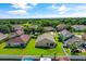 Expansive backyard with lush lawn, partial pool view, and mature landscaping in a suburban neighborhood at 3078 Mandolin Dr, Kissimmee, FL 34744