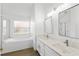 Bathroom features a soaking tub, separate shower, and double sink vanity with modern fixtures at 3078 Mandolin Dr, Kissimmee, FL 34744