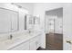 Bathroom featuring double sink vanity, white cabinets, and modern fixtures at 3078 Mandolin Dr, Kissimmee, FL 34744