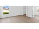 Bright bedroom with hardwood floors, natural light, closet, and an entry way to the bathroom at 3078 Mandolin Dr, Kissimmee, FL 34744