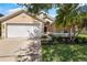 Beautiful single-Gathering home featuring a two-car garage and well-manicured landscaping and inviting entryway at 3078 Mandolin Dr, Kissimmee, FL 34744