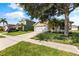 Inviting single-Gathering home with a well-maintained lawn, mature landscaping, and a two-car garage at 3078 Mandolin Dr, Kissimmee, FL 34744