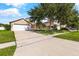 Charming single-Gathering home with a two-car garage and mature landscaping, ready for new homeowners at 3078 Mandolin Dr, Kissimmee, FL 34744