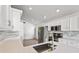 Modern kitchen with stainless steel appliances, quartz countertops, and a stylish backsplash, perfect for cooking at 3078 Mandolin Dr, Kissimmee, FL 34744