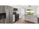 Bright kitchen offers stainless steel appliances, granite countertops, and eat in area with natural light at 3078 Mandolin Dr, Kissimmee, FL 34744
