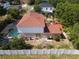 An elevated backyard view, with screened-in pool, large trampoline, and white vinyl fence at 3216 White Blossom Ln, Clermont, FL 34711