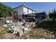 Backyard featuring a screened in pool and a patio with seating, great for relaxing and entertaining at 3216 White Blossom Ln, Clermont, FL 34711
