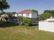 The property features a large fenced-in yard with a screened-in pool and a trampoline at 3216 White Blossom Ln, Clermont, FL 34711
