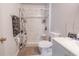 Bright bathroom featuring a tile shower with glass door, modern vanity, and neutral color palette at 3216 White Blossom Ln, Clermont, FL 34711