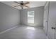 Clean and bright bedroom with ample natural light and light-colored flooring at 3216 White Blossom Ln, Clermont, FL 34711