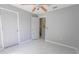 Clean bedroom with natural light, featuring neutral paint and modern flooring at 3216 White Blossom Ln, Clermont, FL 34711