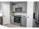 Modern kitchen featuring stainless steel appliances, and mosaic backsplash at 3216 White Blossom Ln, Clermont, FL 34711