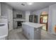 Modern kitchen featuring stainless steel appliances, and a large island at 3216 White Blossom Ln, Clermont, FL 34711