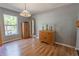 Bright living room with hardwood floors, natural light, and classic furnishing at 3216 White Blossom Ln, Clermont, FL 34711