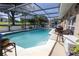Sparkling screened pool with an outdoor seating area, ideal for leisure and entertaining at 3216 White Blossom Ln, Clermont, FL 34711