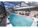 Inviting screened pool, outdoor seating, perfect for relaxing and enjoying warm weather at 3216 White Blossom Ln, Clermont, FL 34711