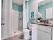 Well-lit bathroom featuring a walk-in shower and vanity with granite countertops at 3429 Briarwood Grove, Ocoee, FL 34761