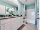 Bathroom featuring double sinks, granite countertop, tub, and custom decor at 3429 Briarwood Grove, Ocoee, FL 34761