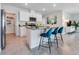 Modern kitchen featuring granite countertops, stainless appliances, and a central island at 3429 Briarwood Grove, Ocoee, FL 34761