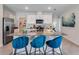 Contemporary kitchen with granite countertops, stainless appliances, and a breakfast bar at 3429 Briarwood Grove, Ocoee, FL 34761