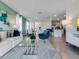 Open-concept living space with modern furniture, tile floors, and a connected dining area at 3429 Briarwood Grove, Ocoee, FL 34761