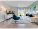 Stylish living room showcasing modern decor, lots of natural light, and tile floors at 3429 Briarwood Grove, Ocoee, FL 34761
