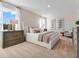 Bright bedroom with carpet, large window, and tasteful decor at 3429 Briarwood Grove, Ocoee, FL 34761
