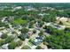 Aerial view of a home in a neighborhood with lush landscaping and mature trees at 347 Timberwood Trl, Oviedo, FL 32765