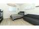 Modern bedroom with sleek furniture, light wood floors, and a minimalist aesthetic at 347 Timberwood Trl, Oviedo, FL 32765