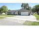 Beautifully landscaped single-story home with a two-car garage and attractive exterior at 347 Timberwood Trl, Oviedo, FL 32765