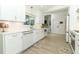 Bright kitchen featuring white cabinets, a window over the sink, and modern appliances at 347 Timberwood Trl, Oviedo, FL 32765