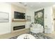 Comfortable living room with a modern fireplace, stylish decor, and a cozy seating area at 347 Timberwood Trl, Oviedo, FL 32765