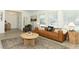 Bright living room featuring neutral decor, a leather sofa, and ample natural light at 347 Timberwood Trl, Oviedo, FL 32765