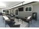 Covered patio with comfortable seating, an outdoor television, and a stylish outdoor rug at 347 Timberwood Trl, Oviedo, FL 32765