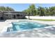 Relax in the backyard with an inground pool, spa, and covered patio for outdoor entertainment at 347 Timberwood Trl, Oviedo, FL 32765