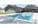 Enjoy the outdoors with a backyard pool, hot tub, and patio with outdoor entertainment space at 347 Timberwood Trl, Oviedo, FL 32765
