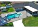 Inviting backyard pool and spa with paver deck, outdoor living space, and lush green lawn at 347 Timberwood Trl, Oviedo, FL 32765
