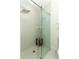 Sleek bathroom featuring a glass-enclosed shower with modern fixtures and white tile surround at 347 Timberwood Trl, Oviedo, FL 32765