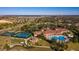 An aerial view of a community center with a pool, tennis courts, a mini-golf green, and other amenities at 3755 Sanibel St, Clermont, FL 34711