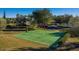 Outdoor basketball court surrounded by green lawns and trees, providing a recreational amenity for residents at 3755 Sanibel St, Clermont, FL 34711
