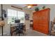 Cozy bedroom featuring built-in murphy bed, desk, and aviation-themed decor for a unique and versatile space at 3755 Sanibel St, Clermont, FL 34711