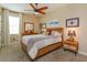Bedroom with a ceiling fan, a neutral color palette, and furnishings at 3755 Sanibel St, Clermont, FL 34711