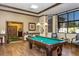 Spacious billiard room features a beautiful pool table, comfortable seating, and elegant decor at 3755 Sanibel St, Clermont, FL 34711