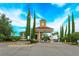 Elegant gated community entrance with water feature and lush landscaping, offering security and curb appeal at 3755 Sanibel St, Clermont, FL 34711