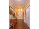Inviting foyer with wood floors, elegant lighting, console table and art work welcomes you into this beautiful home at 3755 Sanibel St, Clermont, FL 34711